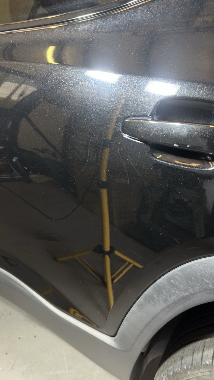 Black vehicle before exterior polishing